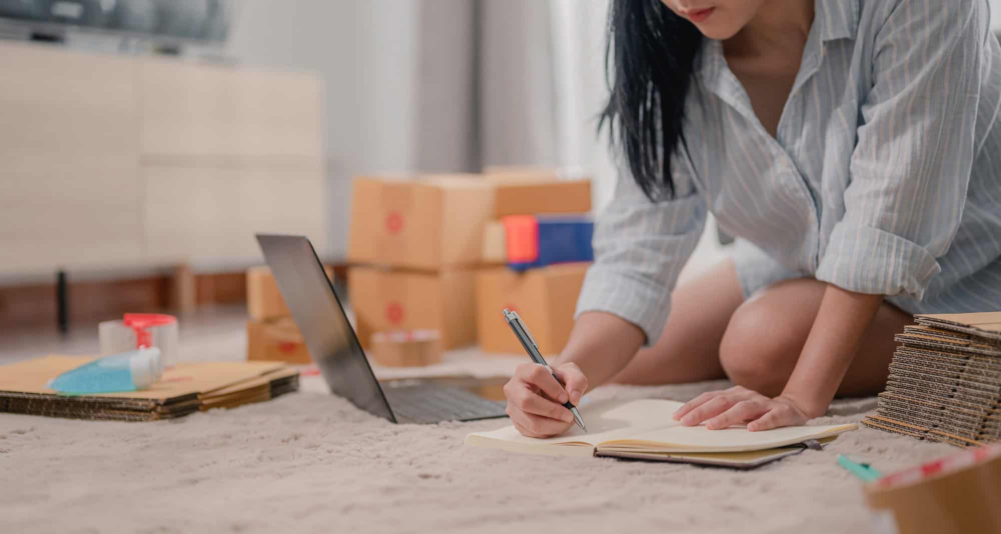 Asian woman entrepreneur owner prepare mail to customer.In business on line,e-commerce,plenty